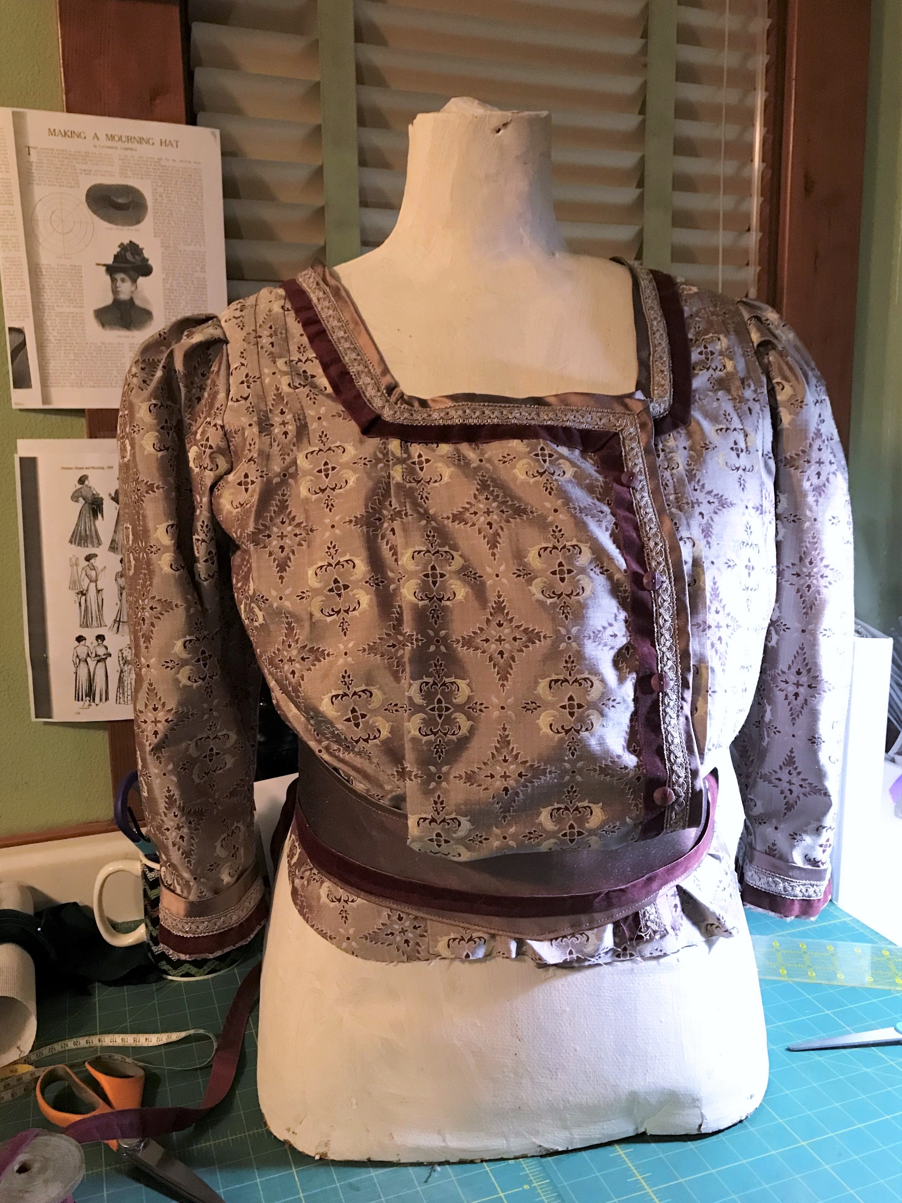 The finished Party Waist and sash on the mannequin